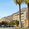 Exterior of the North District Campus Apartments with mountains in the background.