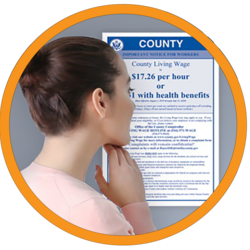 A woman looking at the mandatory posters