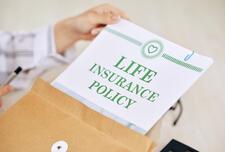 Life Insurance Policy papers in an envelope