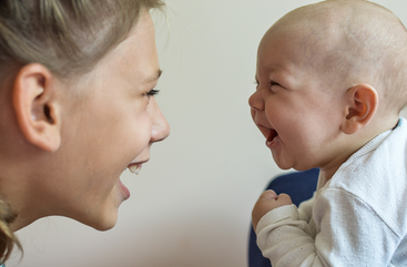 baby loooking at mom