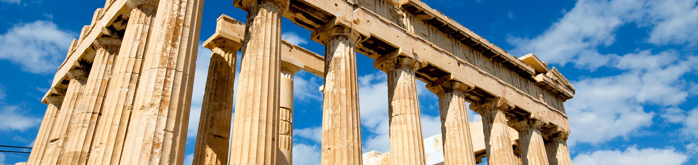 Low angle photo of the Parthenon during the day time