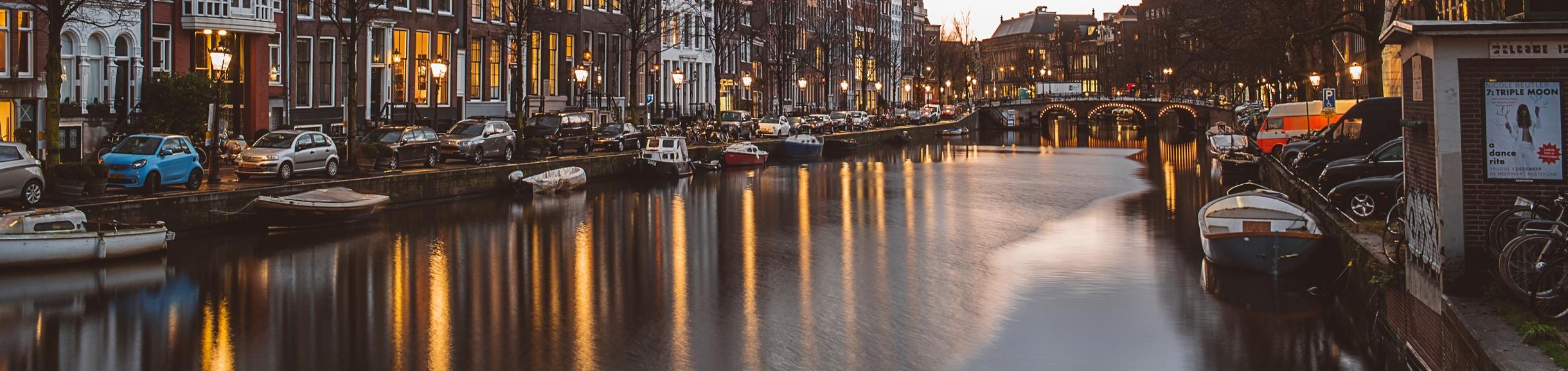 Photo of Amsterdam canal at dusk