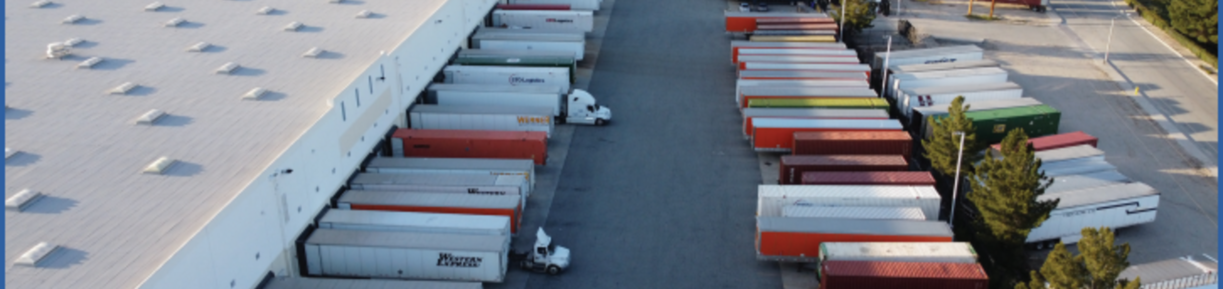 warehouse with semi-trucks outside