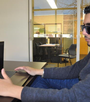Student Kald Alhomse with laptop