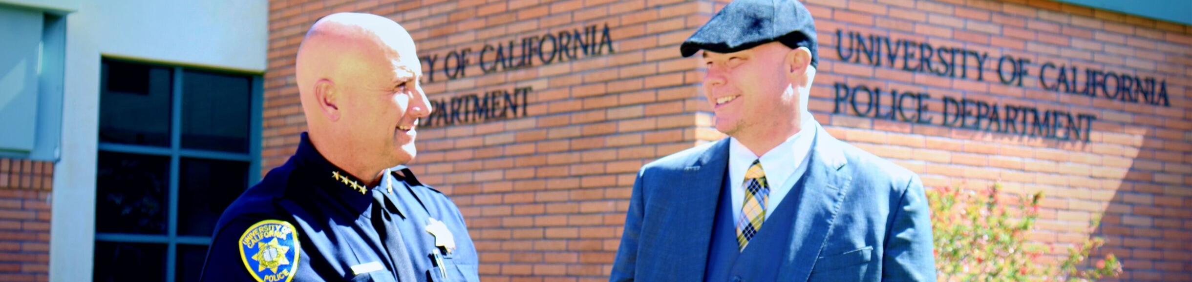 police chief shakes hands with chief information security officer