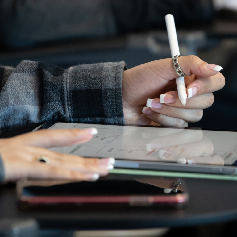 close-up of a hand using a tablet