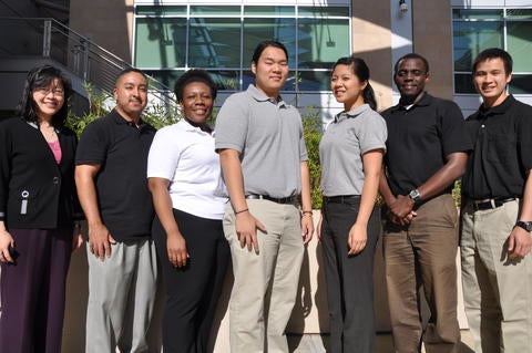 In photo: Kawai Tam (advisor), Jesse Lozano, Etinosa Agbonwaneten, Kenny Chau, Ariana Villanueva, Stephen Opot, and Nhat Nguyen. Not in photo: advisor Mark Matsumoto