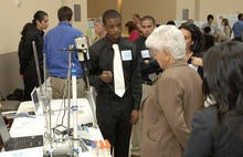Left photo: Matthew Graham (center) and Ruddy Argueta (in back) present to Congresswoman Grace Napolitano at the Southern California World Water Forum held at the Metropolitan Water District headquarters in L.A. Not in photo: Ricardo Torres and Javier 