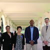 Group photo of Tiffany Moxham, Rochelle Settle, Mihoko Hosoi, Congressman Shomari Figures, and Andrew Lippert under Rivera arches.