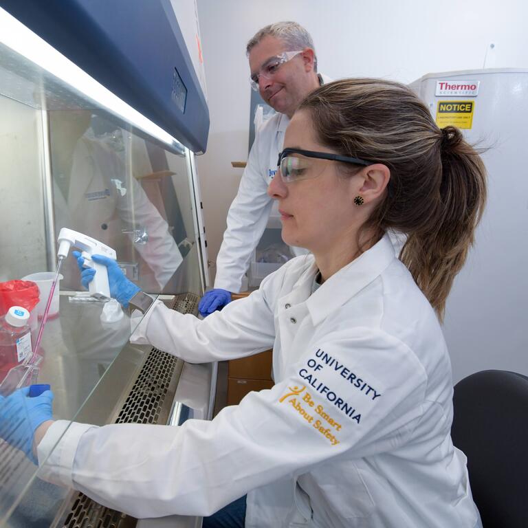 Scott Pegan and student at a fume hood