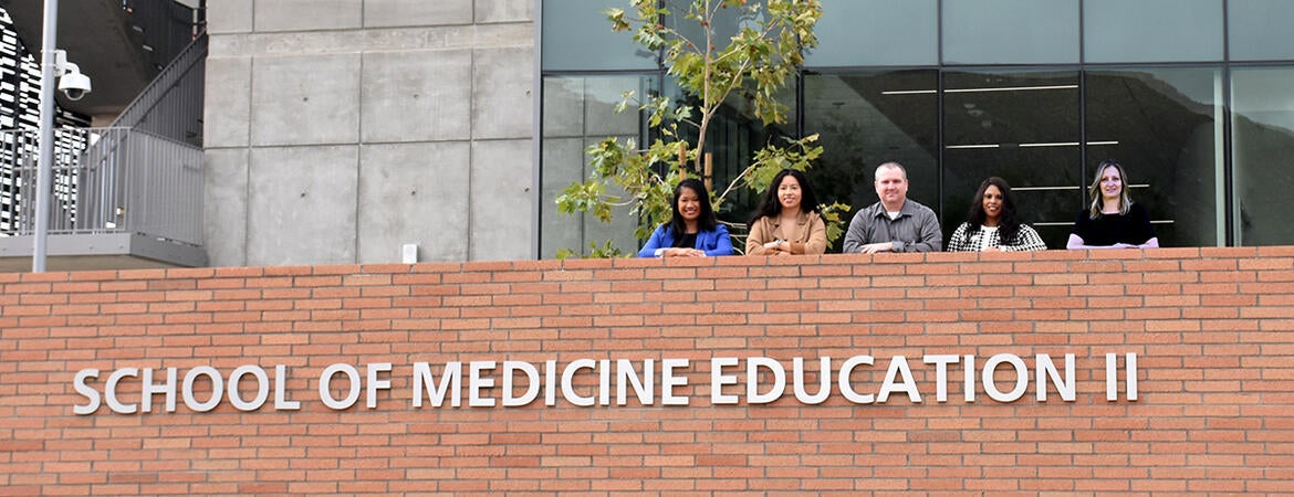 the facilities team outside the SOM Ed II building