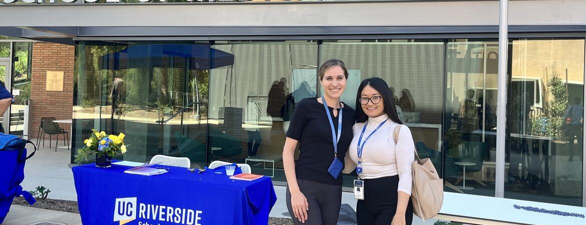 Arpy Barsemian and another administrative fellow in front of the SOM Ed II building