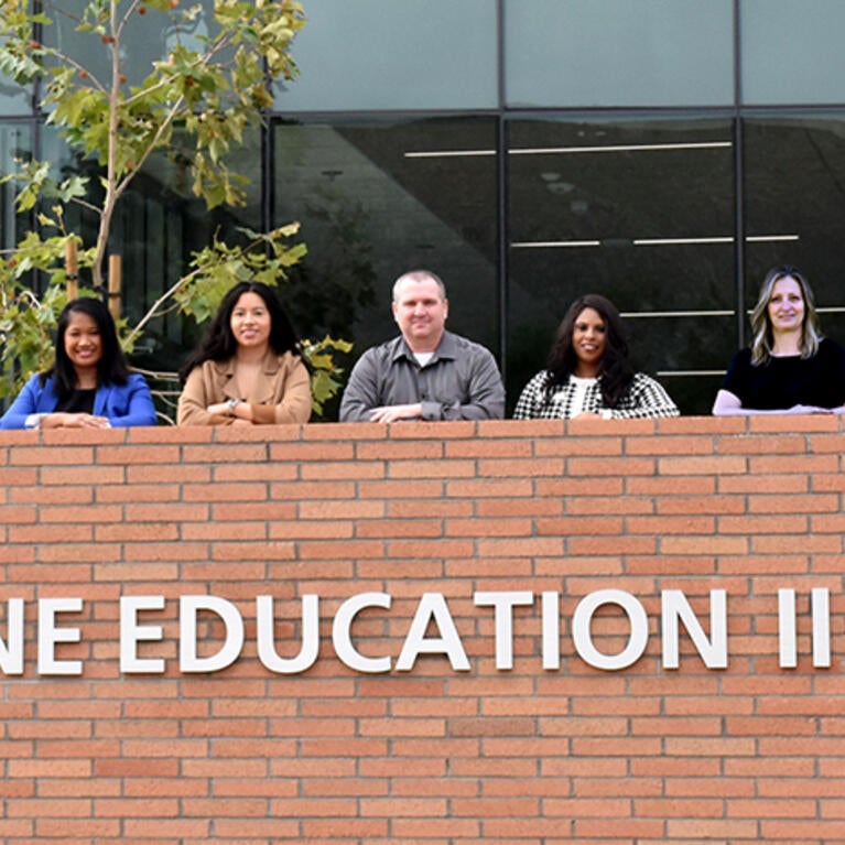 the facilities team outside the SOM Ed II building