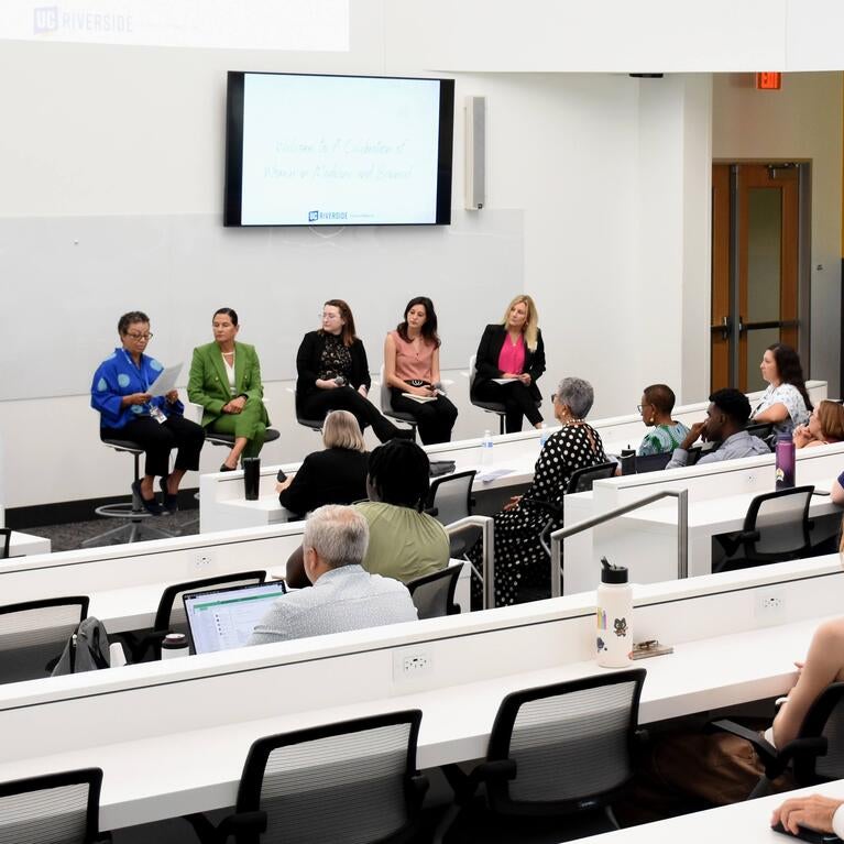 Audience watching the panelists at the WIMS 2025 event