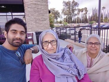 Anser Qazi (left), SOM class of 2025, with family