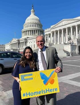 Valeria Barrientos standing holding a sign in Washington, DC