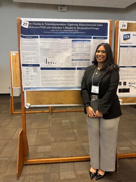 Leilani Tull standing in front of her research poster