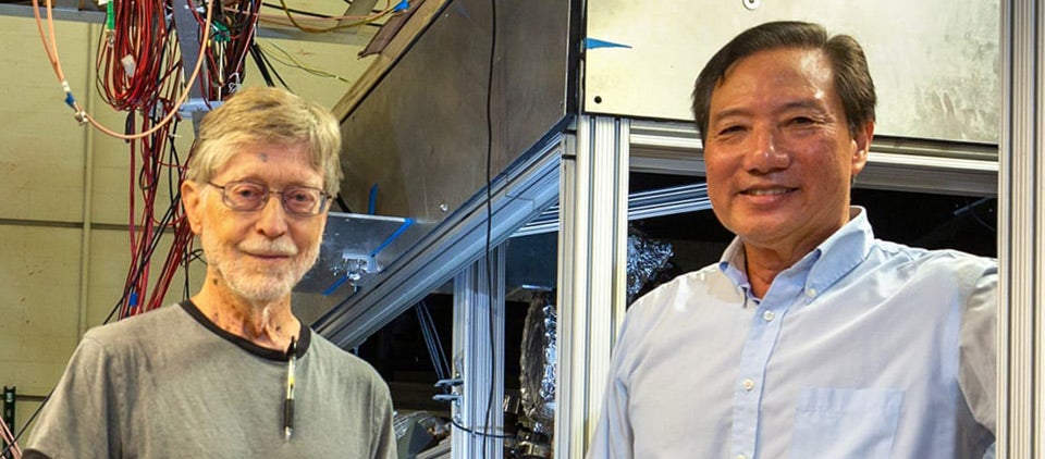 Physicists Allen Mills (left) and Harry Tom