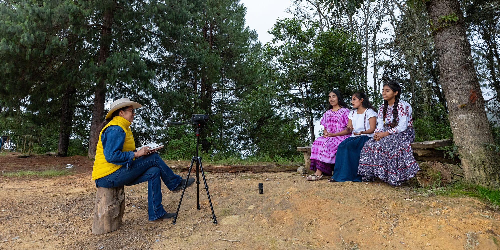 From left: Xóchitl Chávez interviews Mujeres del Viento Florido band members Hanlly Michelle Ruiz Ramírez, María del Rosario Solis Martínez, and Rosa Victoria Gutiérrez Reyes in Tlahui.