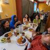 Band members laugh as they enjoy breakfast before performing in Tlahui.