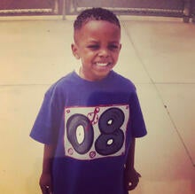 Mike McCollum Jr. smiling on his first day of kindergarten