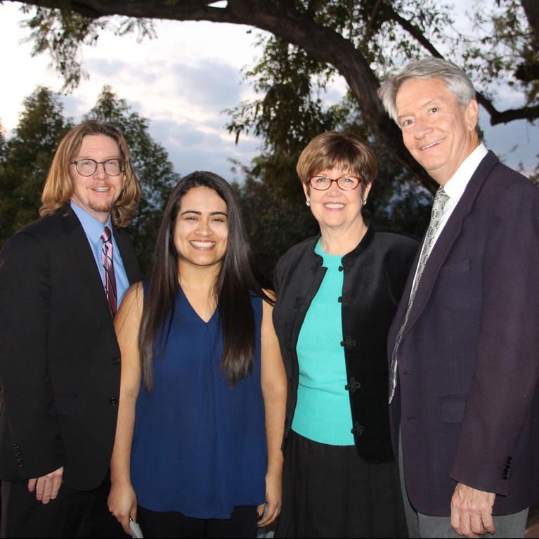 UCR Graduate School of Education Dean Thomas Smith with UCR-RUSD Pipeline Scholarship recipient Maria Hernandez and scholarship fund creators Kathy and John Allavie.