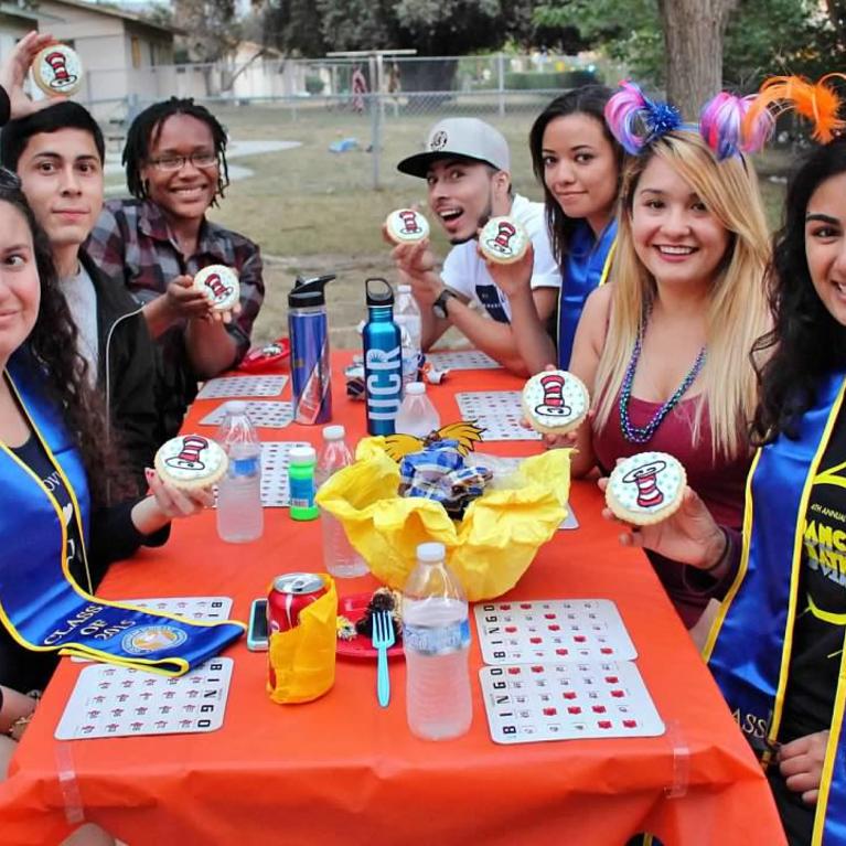 Group of Guardian Scholars at a table celebrating 
