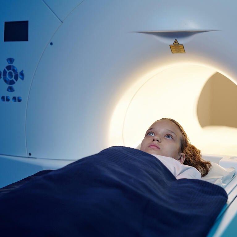 Child moving into an MRI scan machine