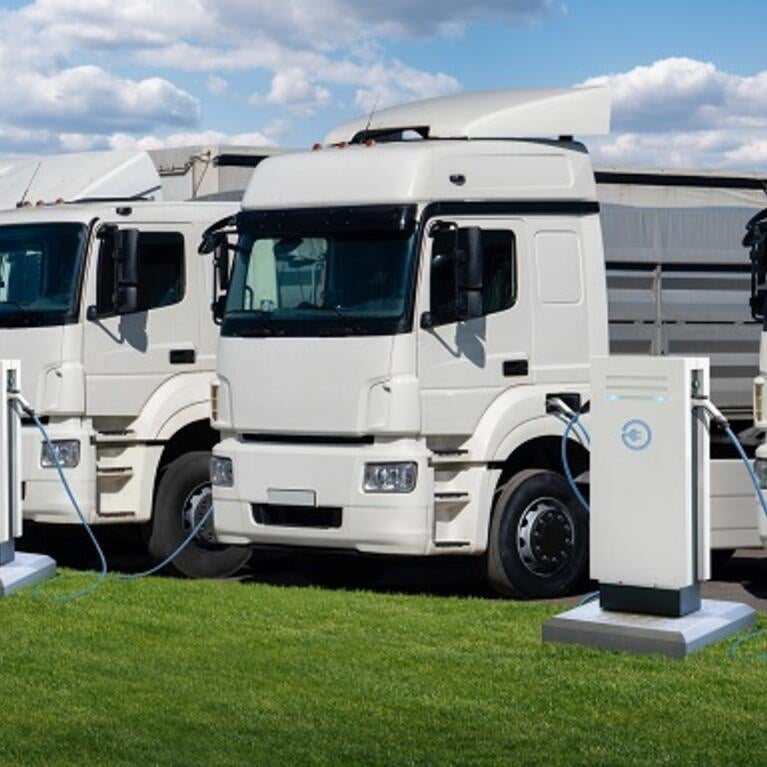 EV trucks at charging stations