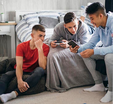 teen boys with cellphones