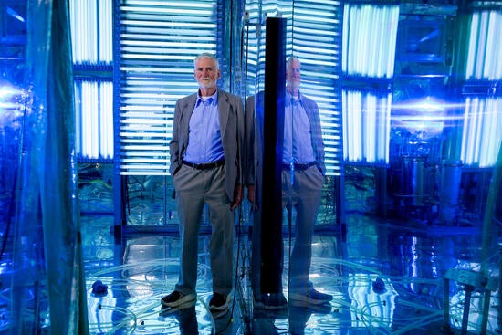 William Carter syands in the atmospheric chamber at UCR's CE-CERT.