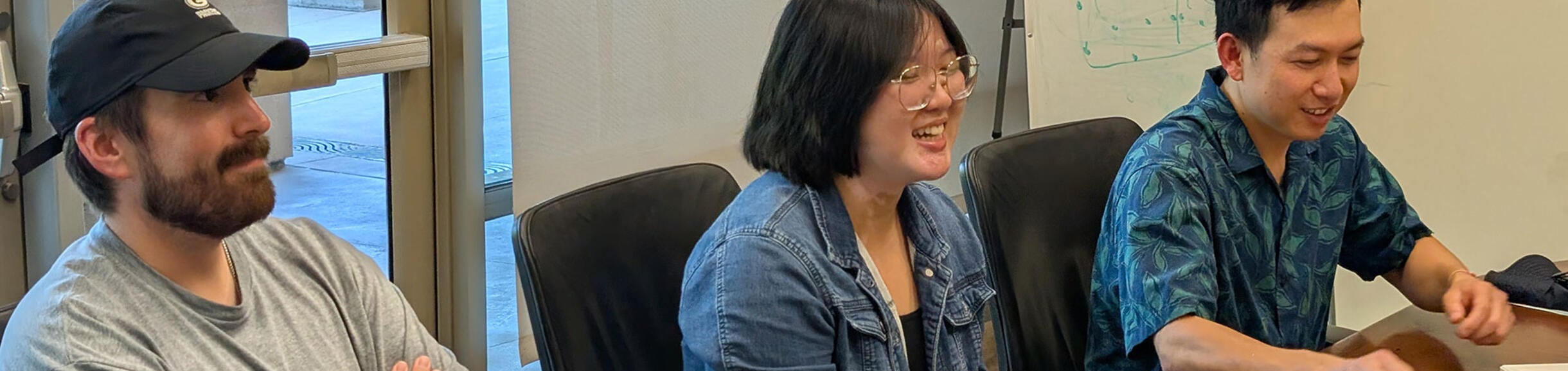 students laughing at a table