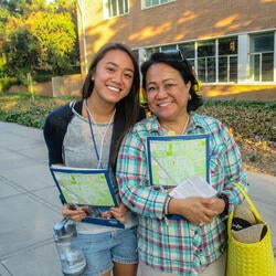 Smiling family member and student