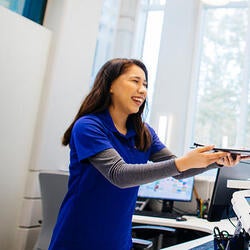 Student Health advisor giving item to stude