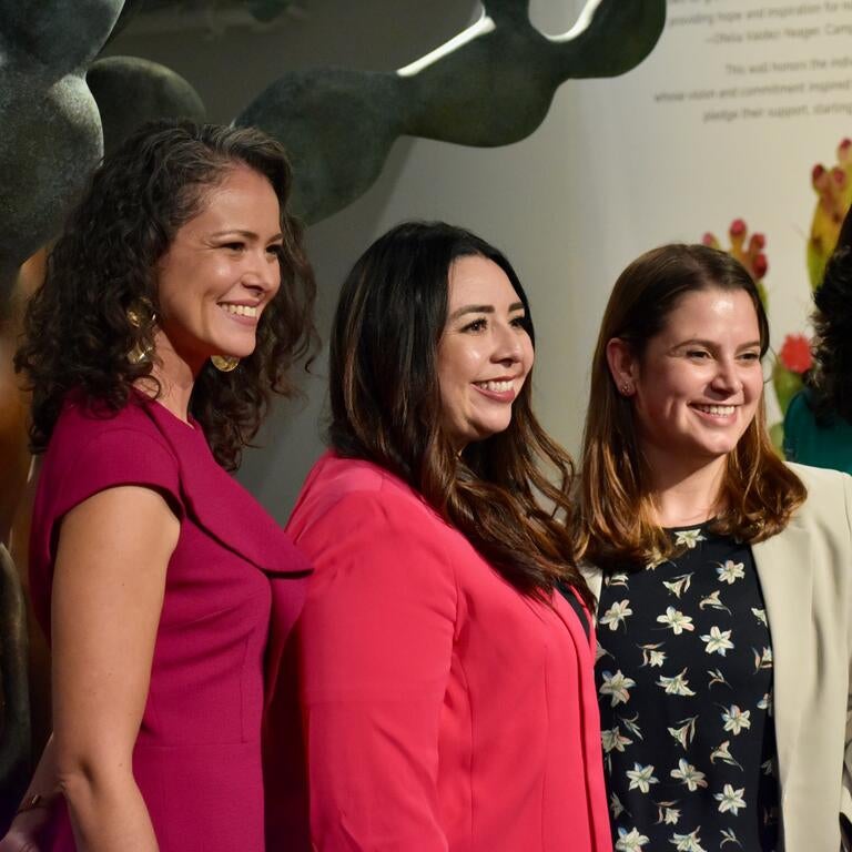 Four women smiling for a picture