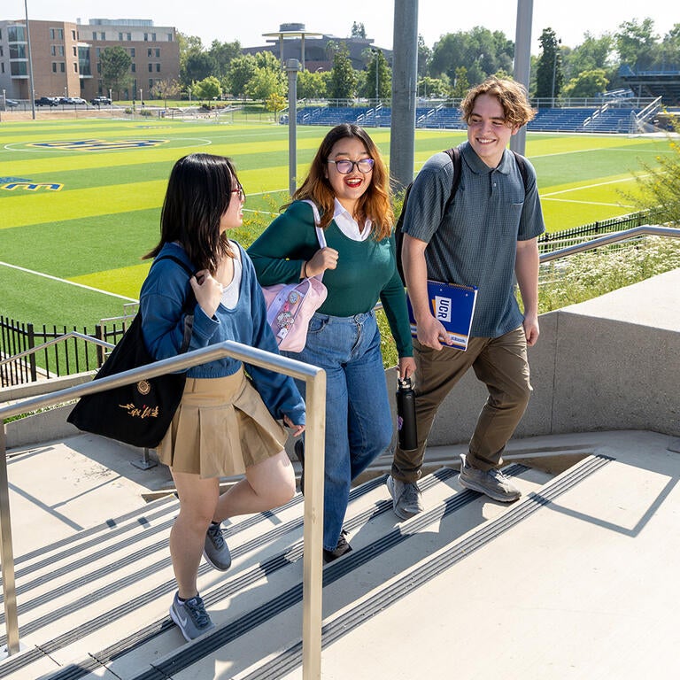 Students walking near the UCR soccer field