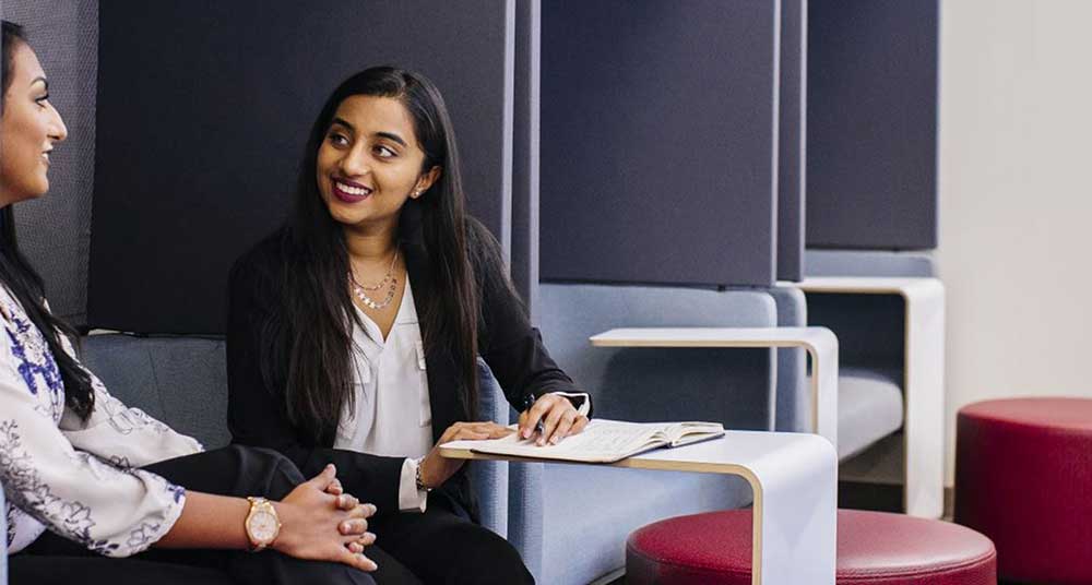 Students sitting at a table talking