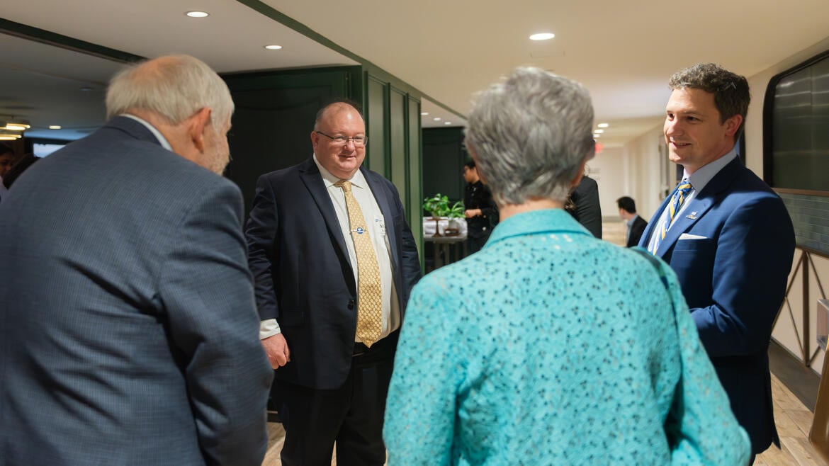 Photo of Dean Long and Elliot Interacting with Guests at D.C. Dinner