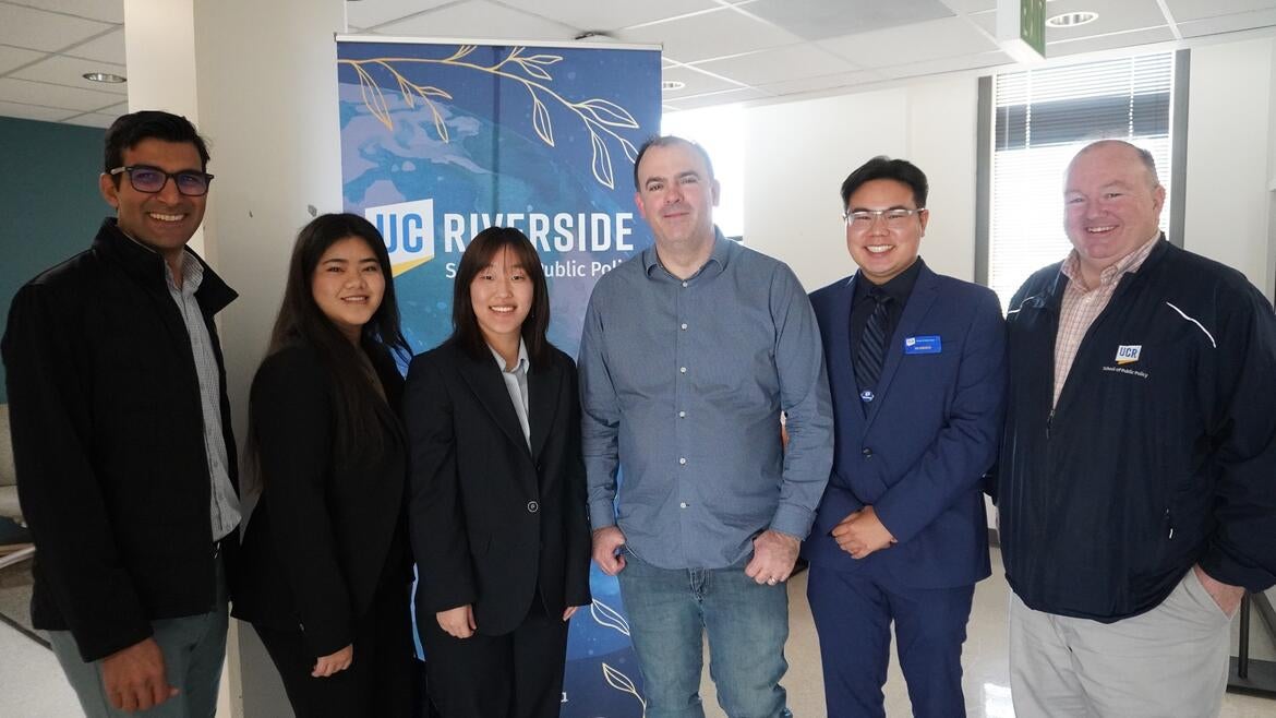 Group Photo of Dr. Bradley Franklin with Students and Dean