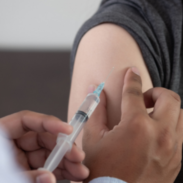 A person getting a shot in a medical office