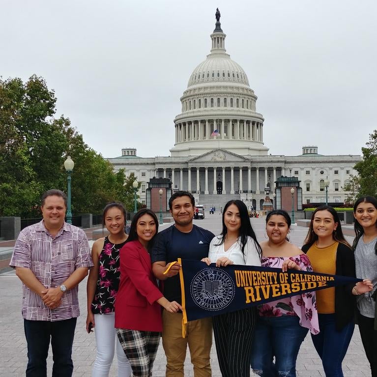 Business students standing in front of DC Capitol building