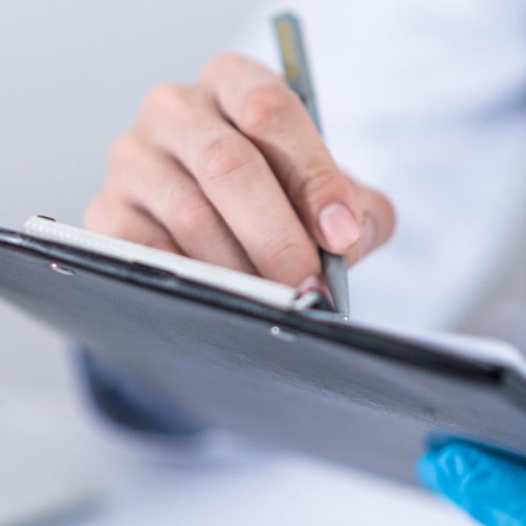 Health worker holding tablet