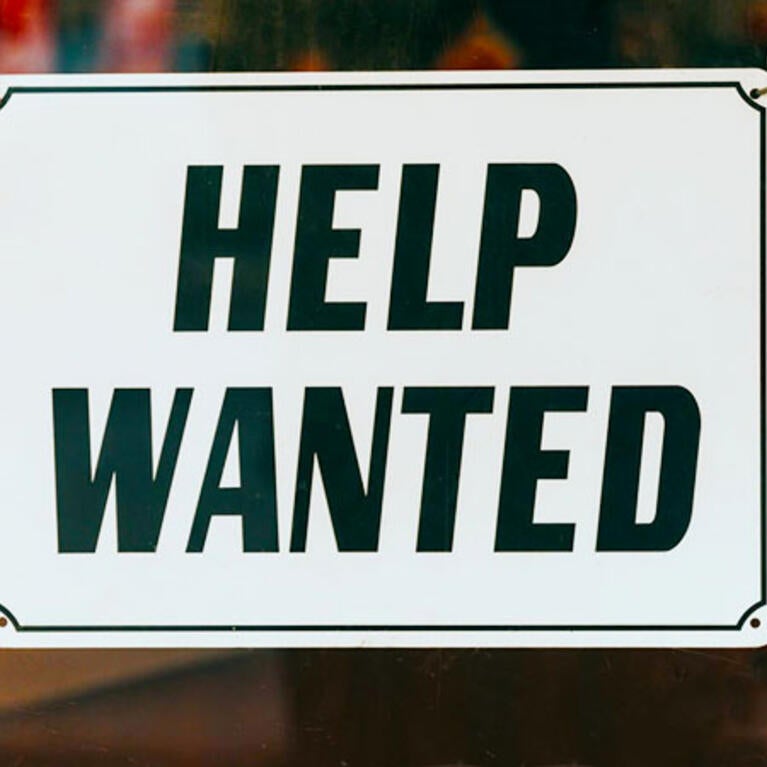 Help Wanted sign on window