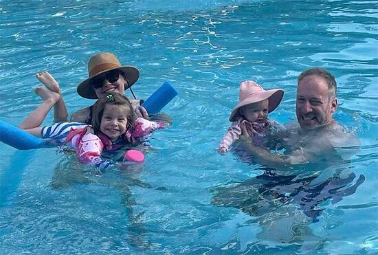 Scott Ganz and family in a swimming pool