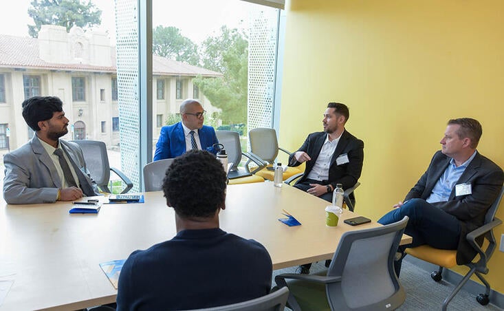 Andrew Pramschufer ’98 meets with Students