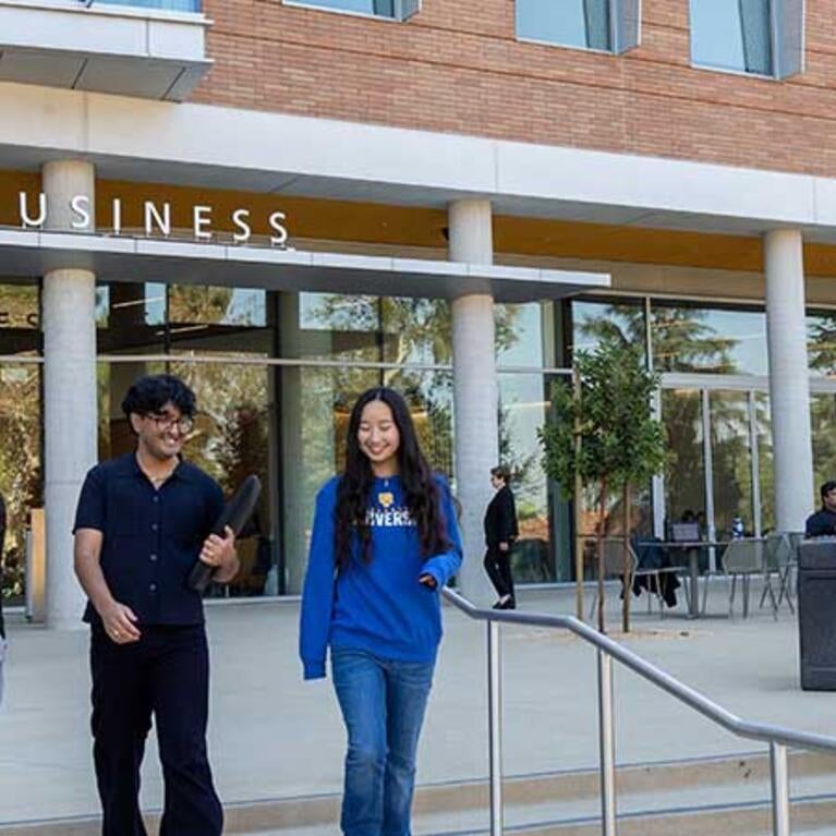 New School of Business building with students on front terrace