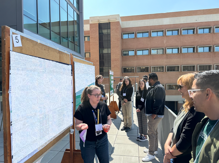 student presenting a poster