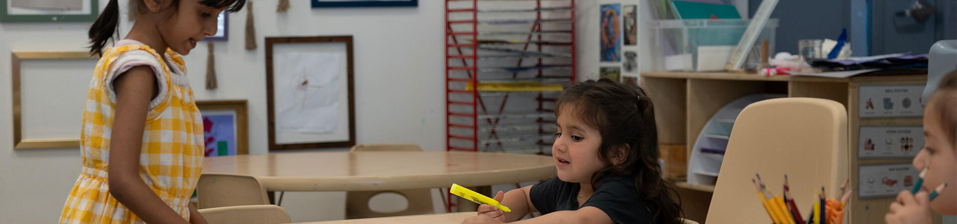 children drawing at table