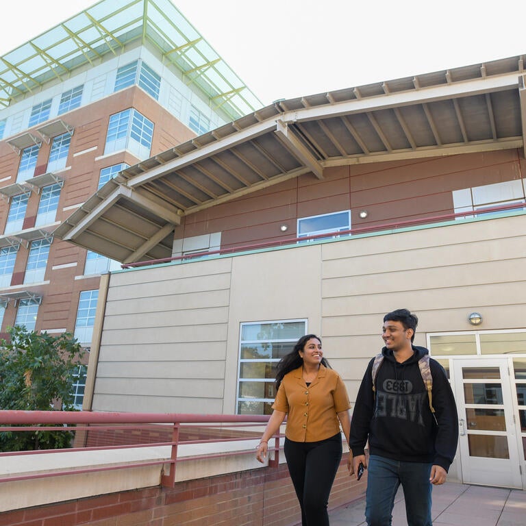 Students on the CHASS building upper patio