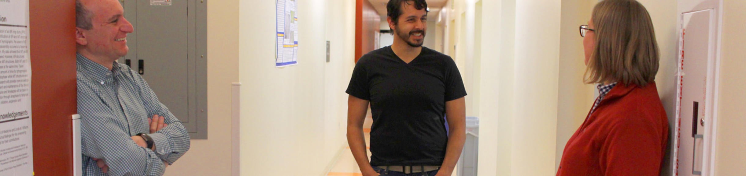 Graduate student talking with faculty